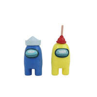 Among Us crewmate figures: blue crewmate with white headpiece, yellow crewmate with red horn