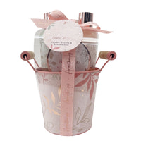 Aromatherapy bath gift set with floral bucket, ribbon, and round “Bath Gifts” tag