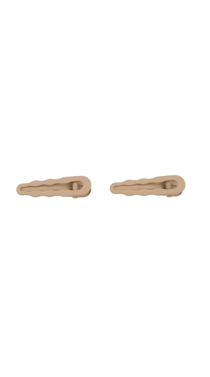Beige wavy snap hair clips, pair shown from side