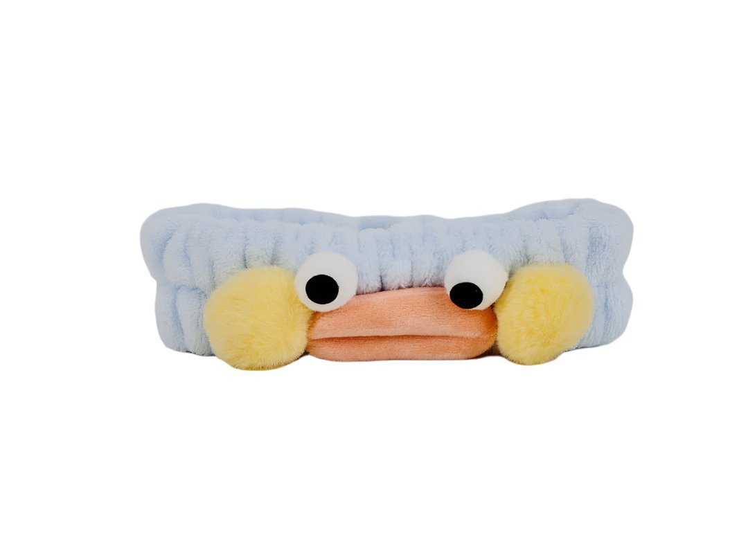 Light blue plush animal big-eye headband with yellow side pads and orange beak