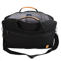 Black canvas laptop bag with front zipper, shoulder strap, and tan-trim handle