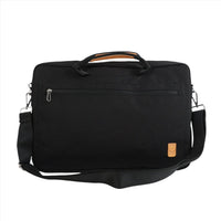 Black canvas laptop bag with side zipper and tan logo patch, crossbody strap