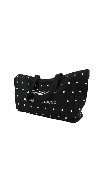 Black dot tote bag with two handles and white star-like dots, front slogan print