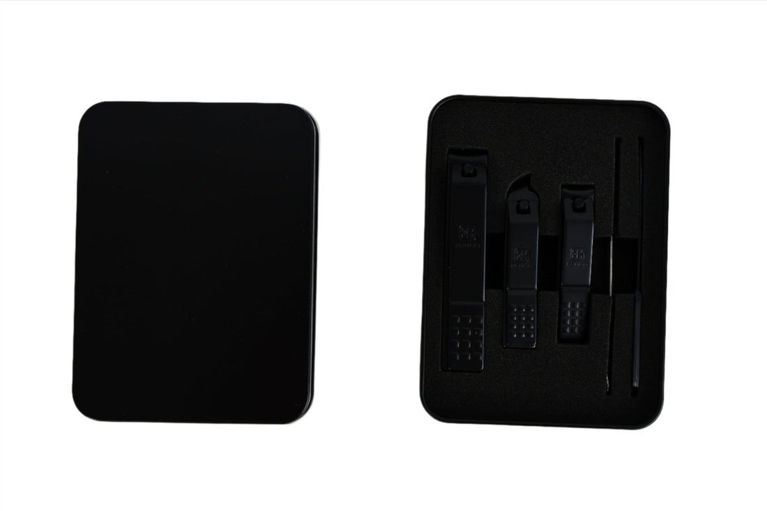 Black manicure set storage case with built-in slots for tools