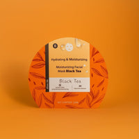 Hydrating facial mask package with black tea label, orange leaf design