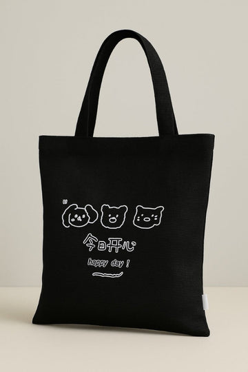 Black tote bag with three bear faces and 'happy day' text graphic on front
