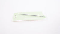 Facial pore extraction tool with long metal handle and loop tip