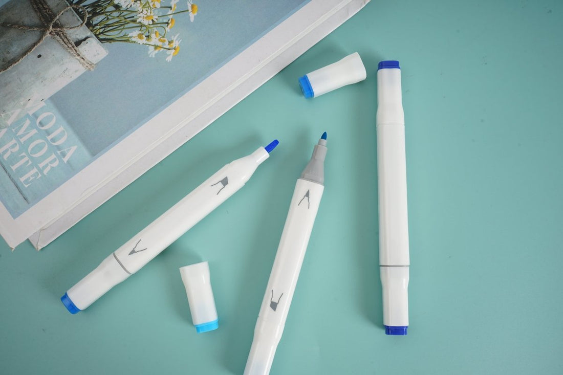 Blue highlighter set of 3, white bodies with blue tips, laid out