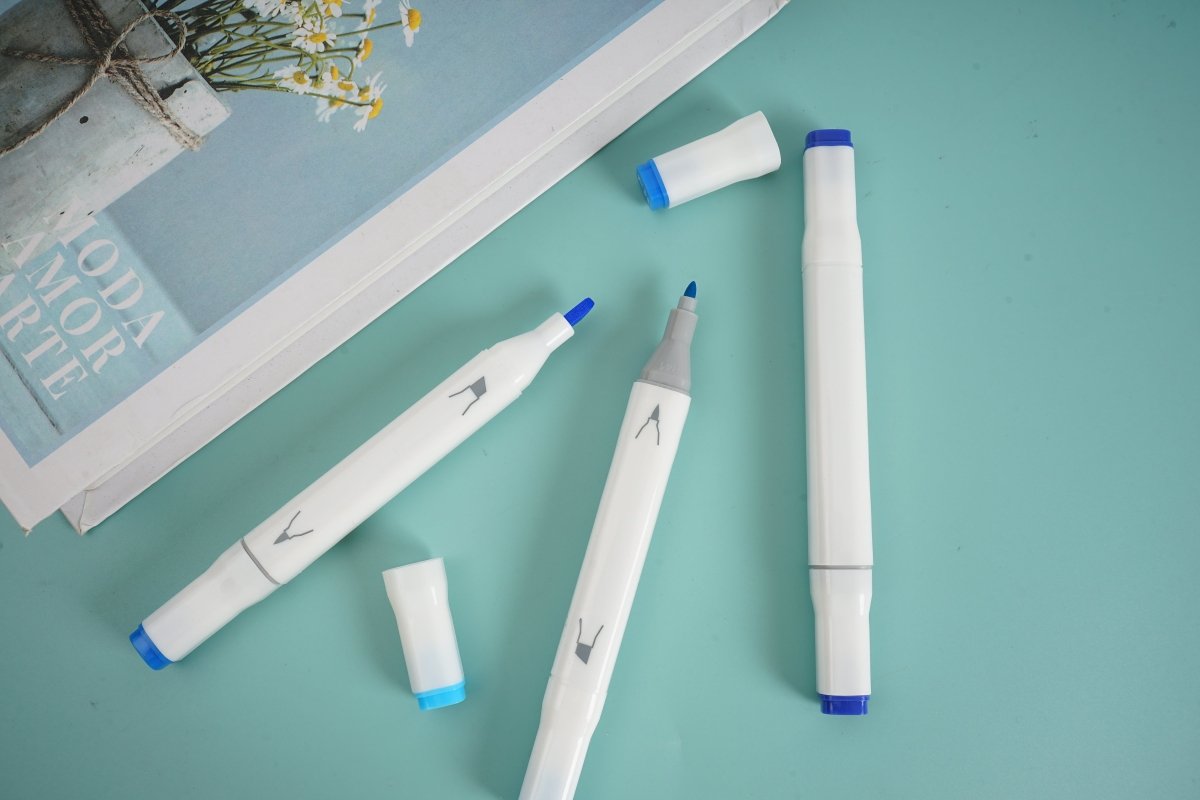 Blue highlighter set of 3, white bodies with blue tips, laid out