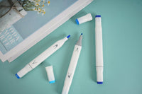 Blue highlighter set of 3, white bodies with blue tips, laid out