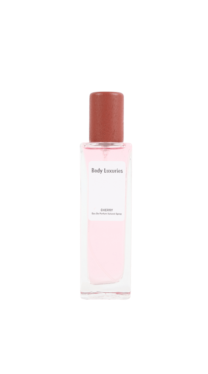 Cherry perfume spray bottle with rose-pink tinted liquid and red cap