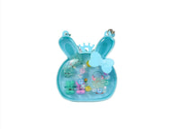 Light blue bunny-shaped hair accessory set with bead handle, crown, and bow charms