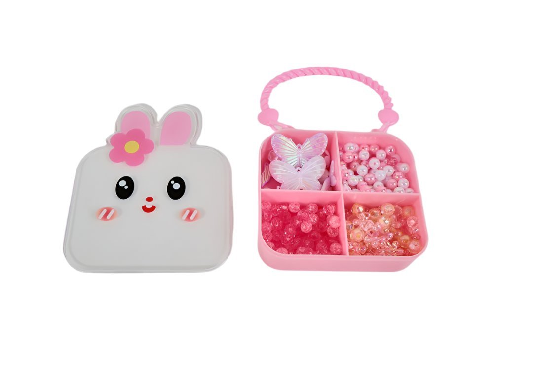 Kids bunny jewelry box with pink bunny face and open compartments of beads