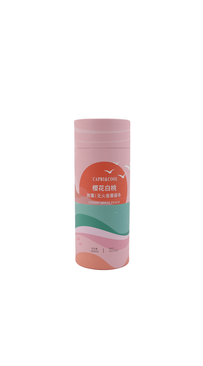 Reed diffuser container with cherry-peach label wrap and pink cap