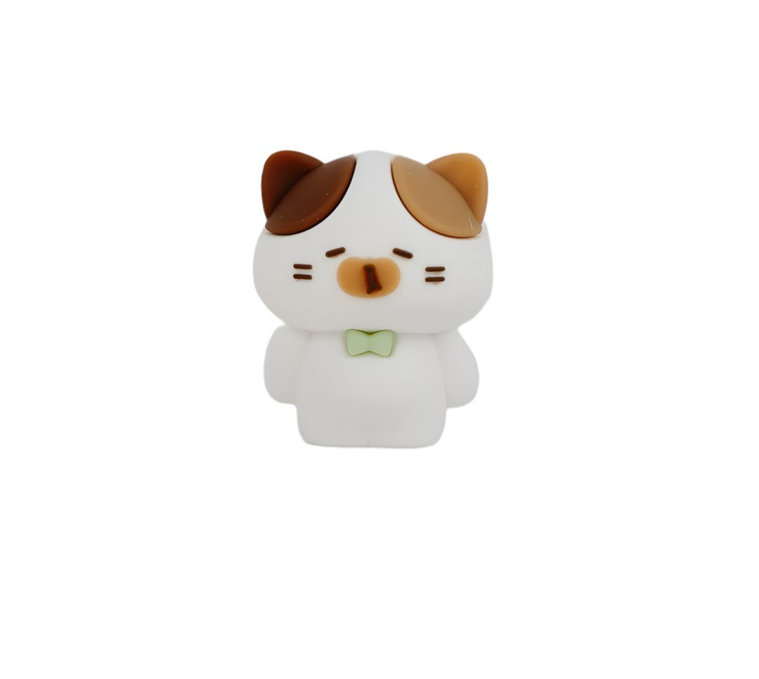 White cat-shaped pencil sharpener with green bow tie and brown ear accents