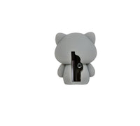Gray cat-shaped pencil sharpener with exposed blade opening, back view
