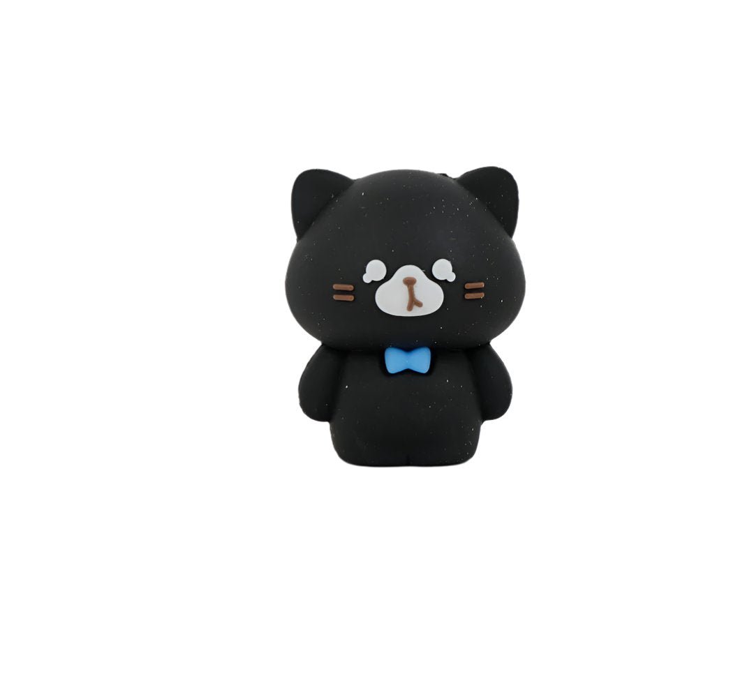Black cat-shaped pencil sharpener with blue bow tie and white face