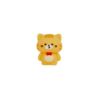 Yellow cat-shaped pencil sharpener with red collar and cute face