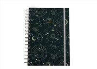 Celestial notebook with dark cover, spiral binding, and vertical ribbon bookmark.