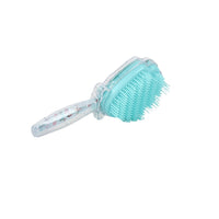 Plastic hair brush with shell-shaped bristles, teal brush head on clear handle.