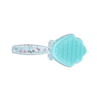 Plastic hair brush with shell-shaped bristles, teal color and clear handle.