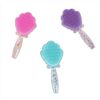 Set of three plastic hair brushes with heart-shaped bristles in pink, purple, and teal.