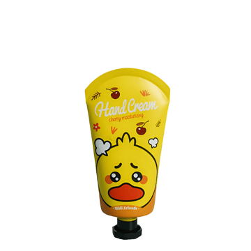 Yellow hand cream tube with character face label and cherry text