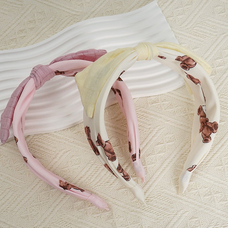 Pink and off-white headbands with soft knots and animal-print fabric bands