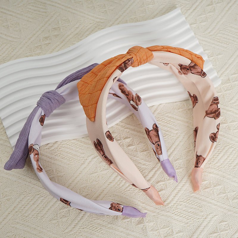 Orange, purple, and light pink headbands with soft knots and animal-print bands