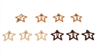 Set of star-shaped hair clips in neutral and dark brown tones.