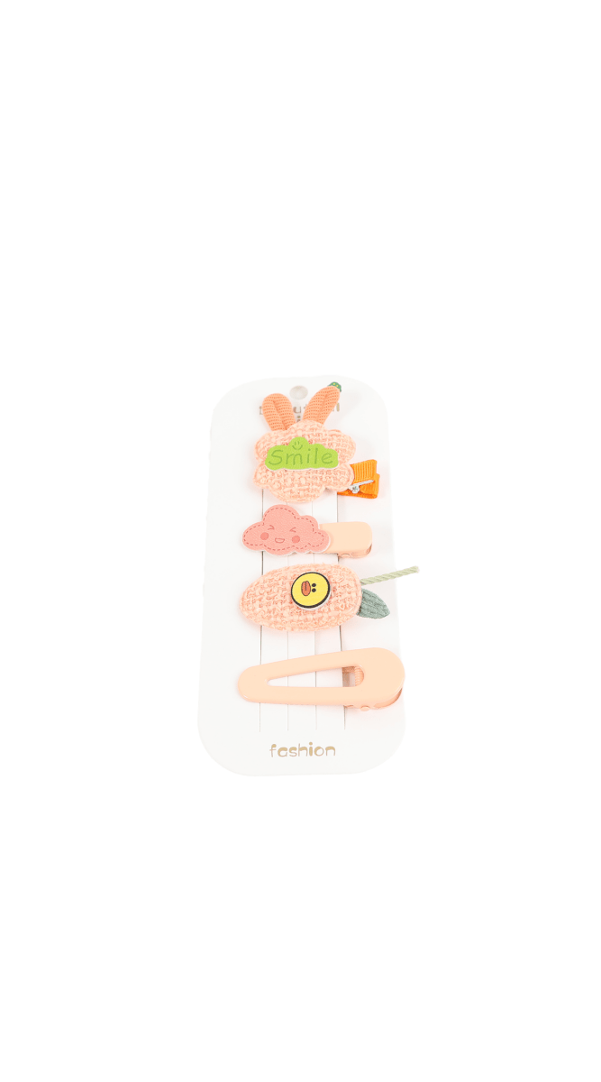 Children's hair accessory set with pink clips and a bow-style band on a card