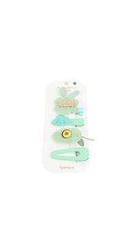 Children's hair accessory set with green clips and flower-shaped pieces on a card
