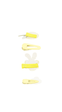 Children's hair accessory set with yellow bow and clips, shown laid out
