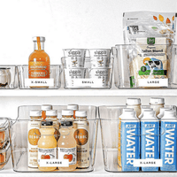 Clear plastic organizer bins holding bottles and cans on a shelf