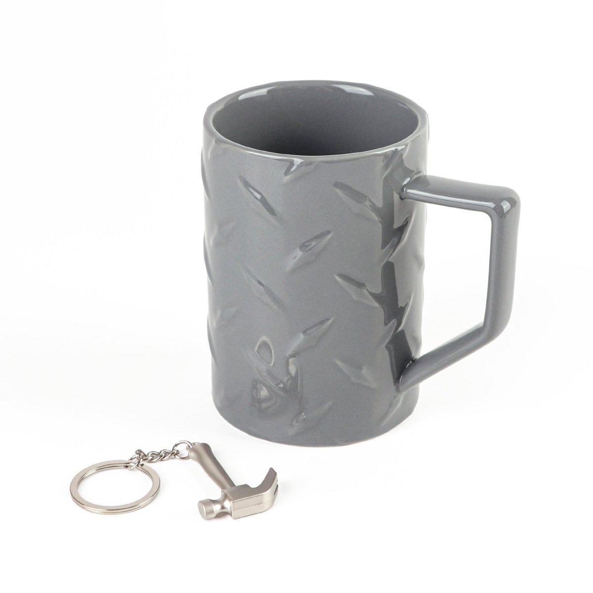 Gray ceramic mug with molded pattern; includes metal key ring and small charm