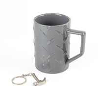 Gray ceramic mug with molded pattern; includes metal key ring and small charm