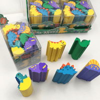 Pack of dinosaur erasers in clear bins, featuring yellow, green, blue, and purple designs