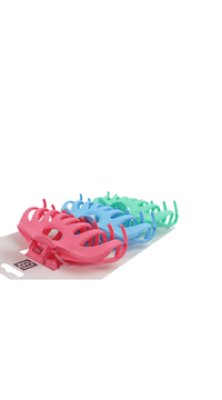 Assorted plastic hair clips in red, blue, green, and pink displayed on cards