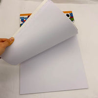 Stack of blank white pages inside the space coloring book