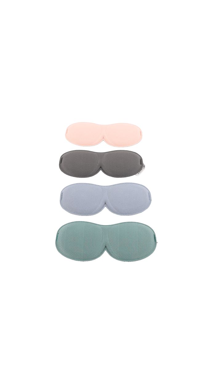 3D sleep eye masks stacked in light pink, dark gray, blue, and teal