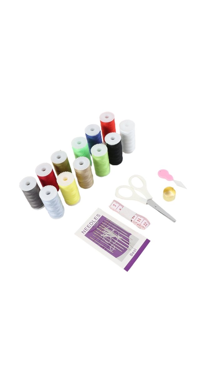 Sewing kit with colorful thread spools, scissors, needle pack, and small accessories