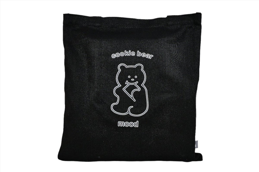 Black tote bag with centered bear logo on the front panel