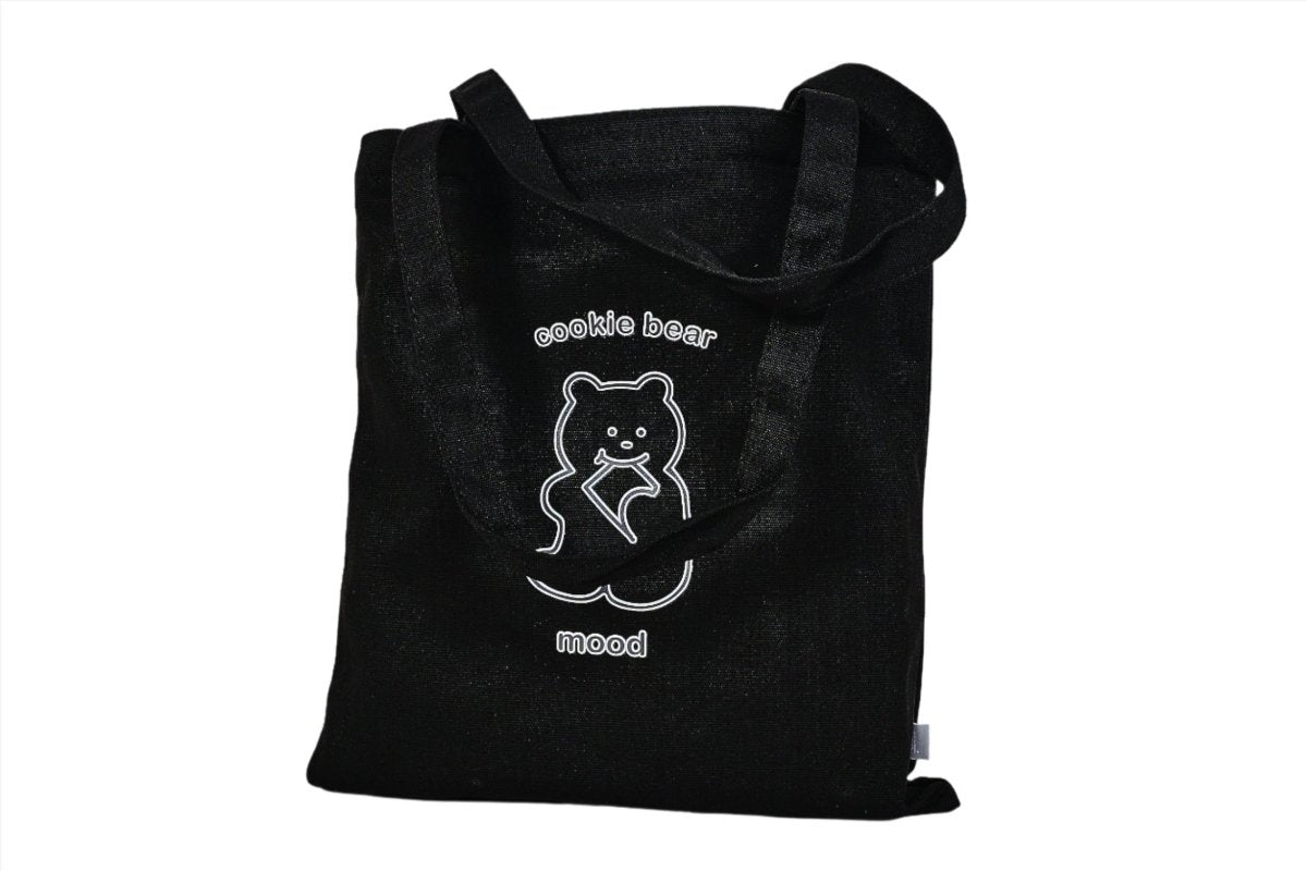 Black tote bag with bear logo and visible top carry handles