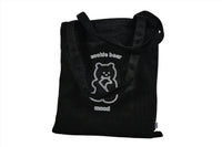 Black tote bag with bear logo and visible top carry handles