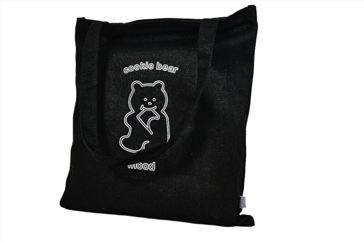 Black tote bag with bear logo on the front and top straps