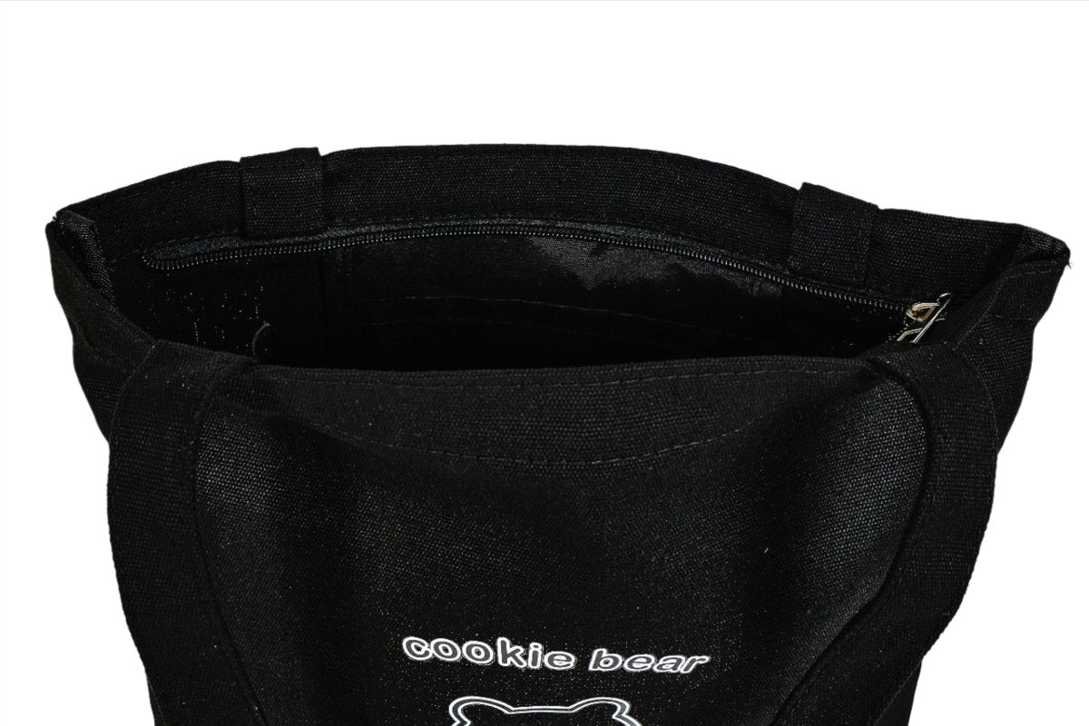Black tote bag with open top, inner lining, and bear logo on front