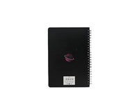 Black spiral notebook back cover with small planet graphic and barcode label