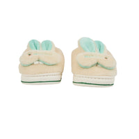 Cream plush slip-on bunny slippers with mint ears and green-striped rubber sole