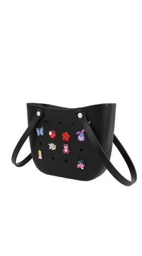 Silicone kids crossbody bag in black with colorful character charms and shoulder strap