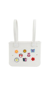 White silicone shower caddy with two loop handles, front view with sticker charms